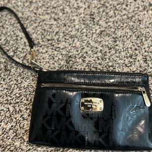 Michael Kors Black patent leather wristlet
No flaws